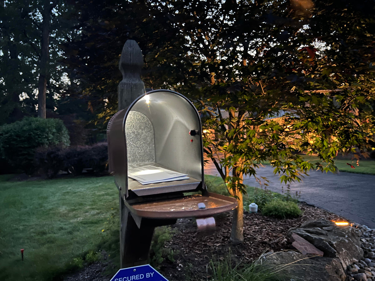 solar powered mailbox night light installed on rural mailbox